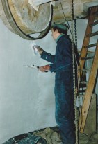 Plastering the stone floor walls